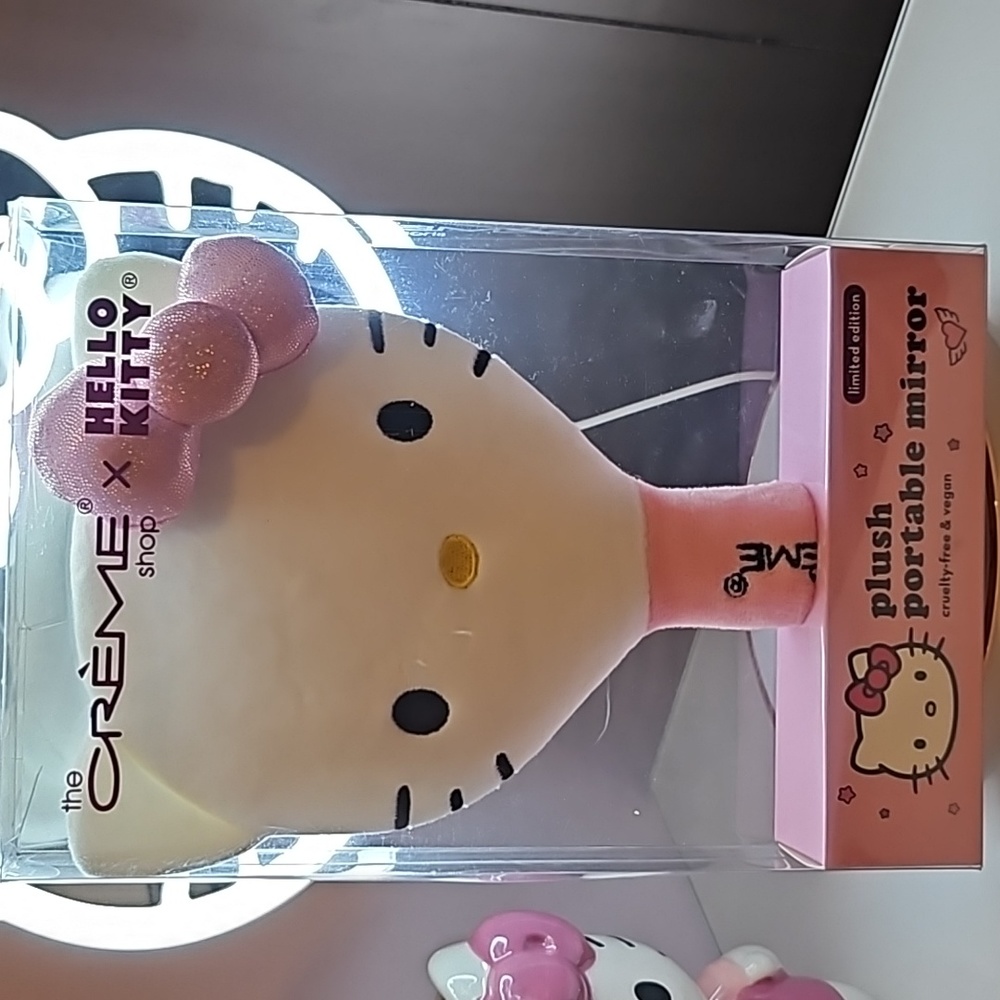The creme hello kitty plush portable mirror